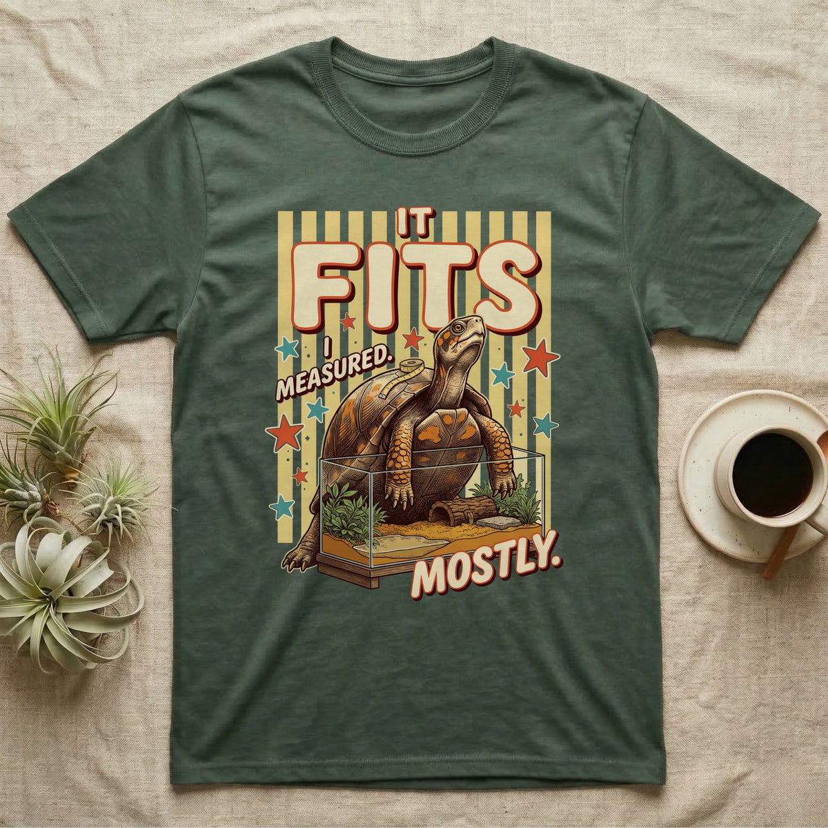 Box Turtle Enclosure Upgrade T-Shirt in Military Green — Engraved box turtle sitting beside a huge planted glass terrarium under fat IT FITS club lettering.