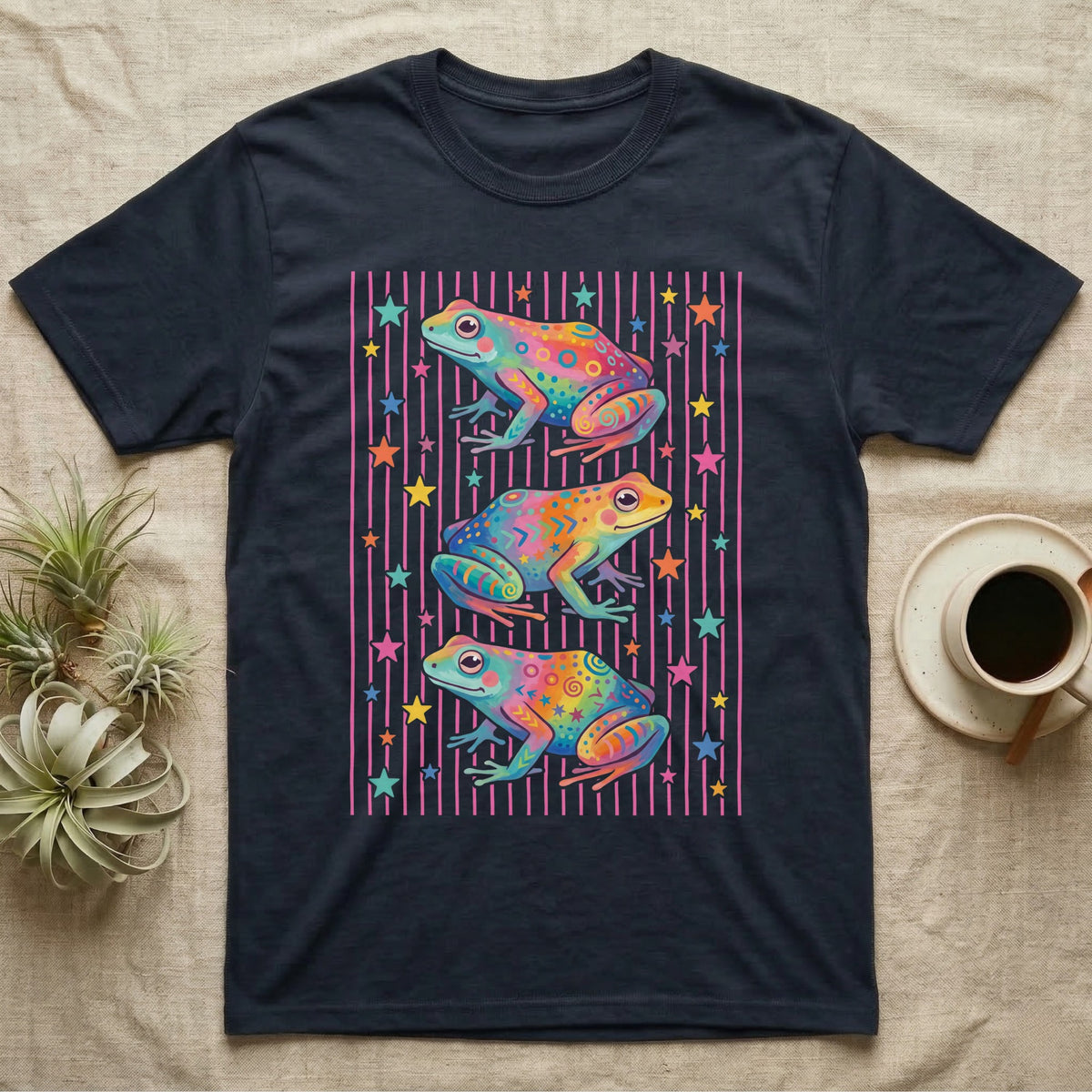 Dart Frog Disco Stripes T-Shirt in Navy — Three rainbow poison dart frog morphs stacked on a pink-and-cream candy-stripe field with scattered stars.