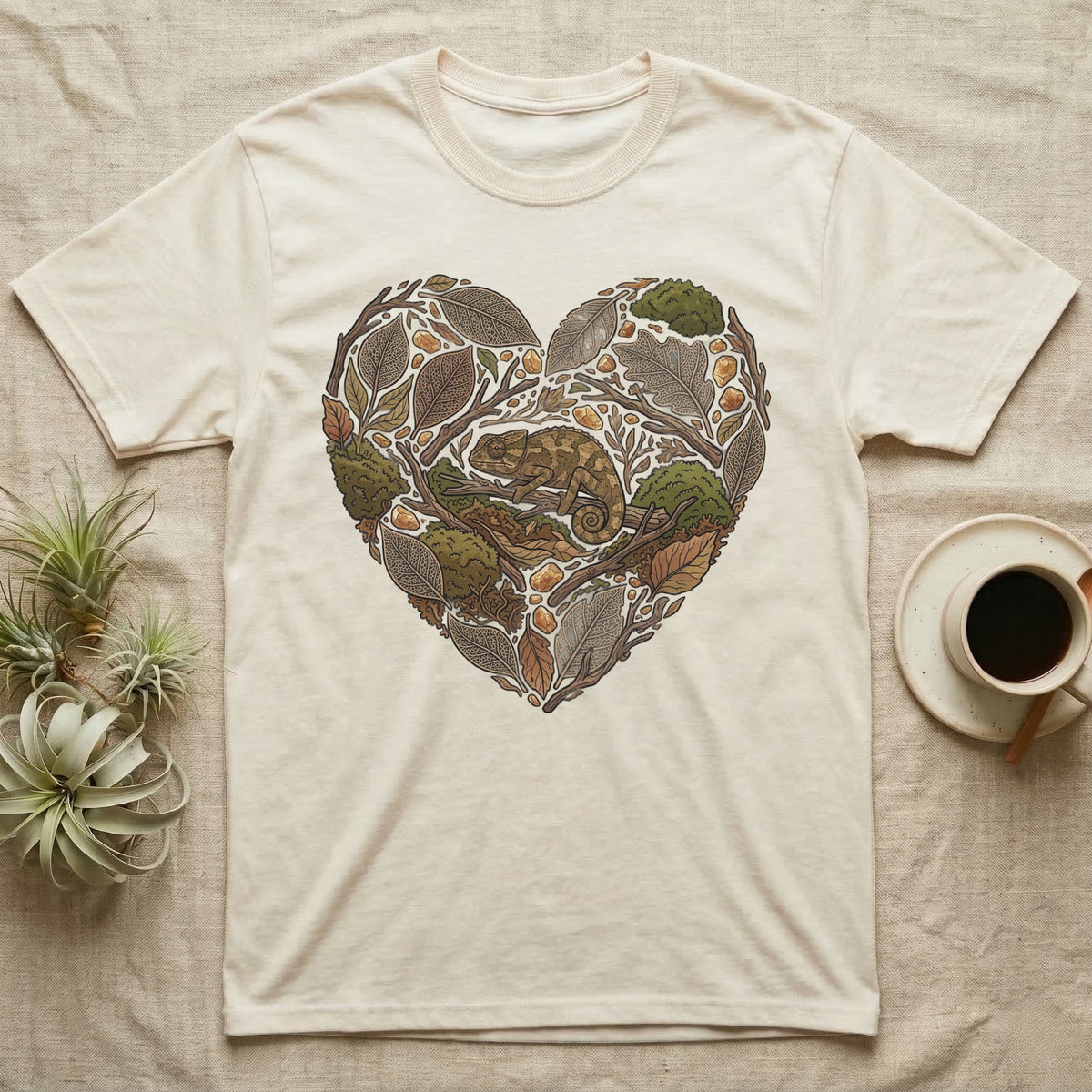 Cream t-shirt with heart-shaped chameleon and nature graphic.