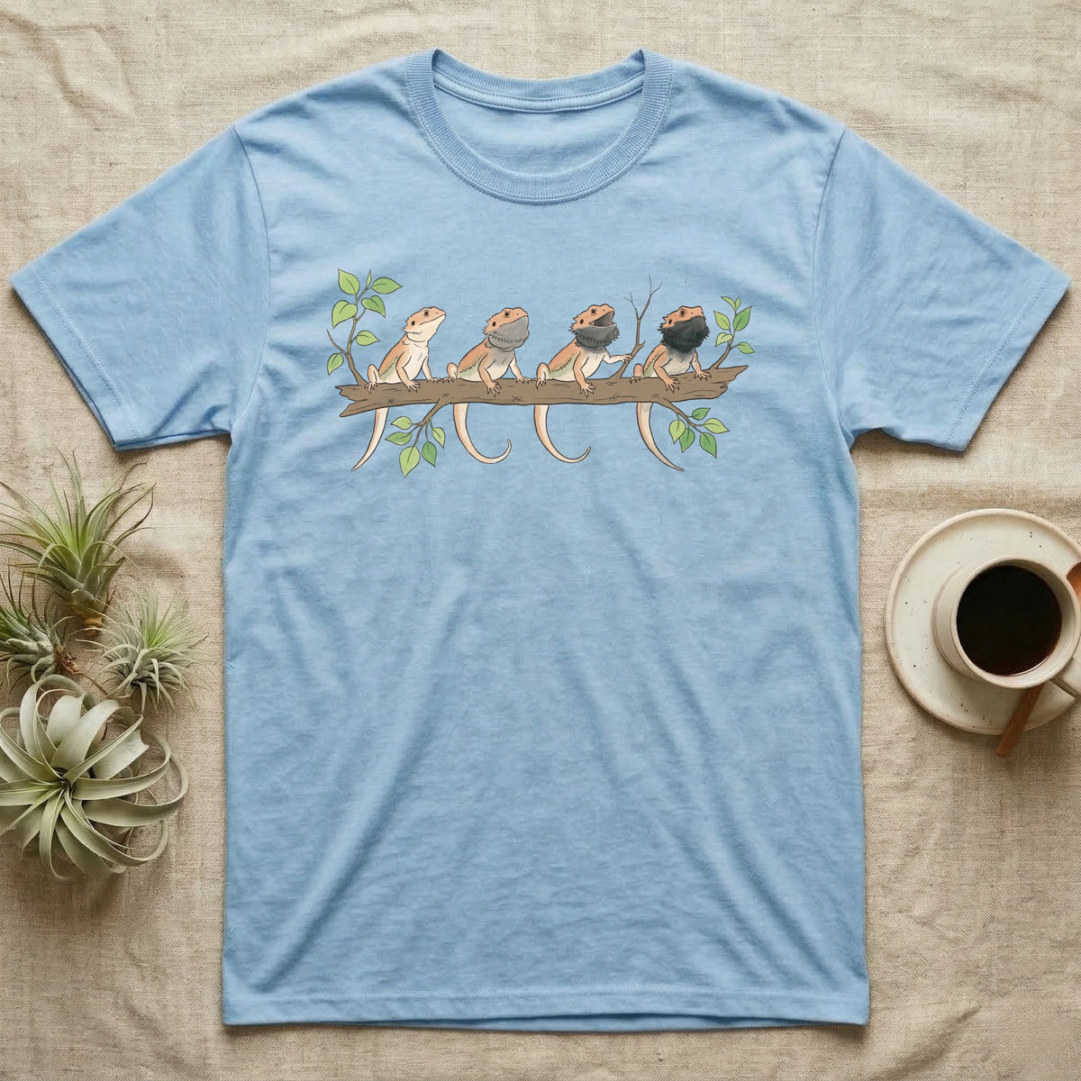 Bearded Dragon Beard States T-Shirt in Light Blue — Watercolour illustration of four bearded dragons on a branch, each with a different beard and mouth state.