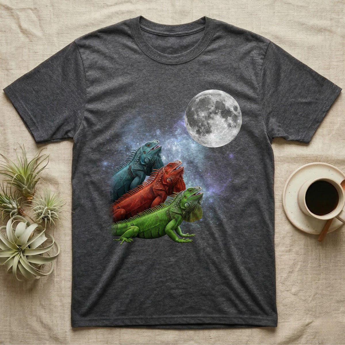 Green Iguana Moon Howl T-Shirt in Dark Heather — Three Green Iguana colour morphs howling at a full moon over a nebula on a dark grey t-shirt.