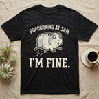 Guinea Pig Popcorning 3AM Tee in Black — Grunge-distressed guinea pig mid-popcorn with all four feet airborne and distressed type "Popcorning At 3AM I'm Fine."