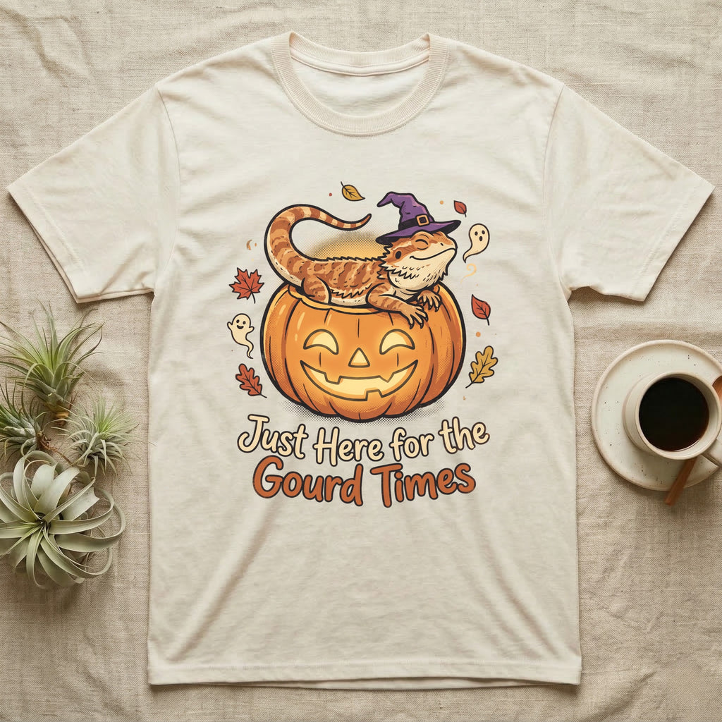 Bearded Dragon Gourd Times T-Shirt in Natural — Cartoon bearded dragon in a witch hat lounging in a jack-o'-lantern, "Just Here for the Gourd Times."