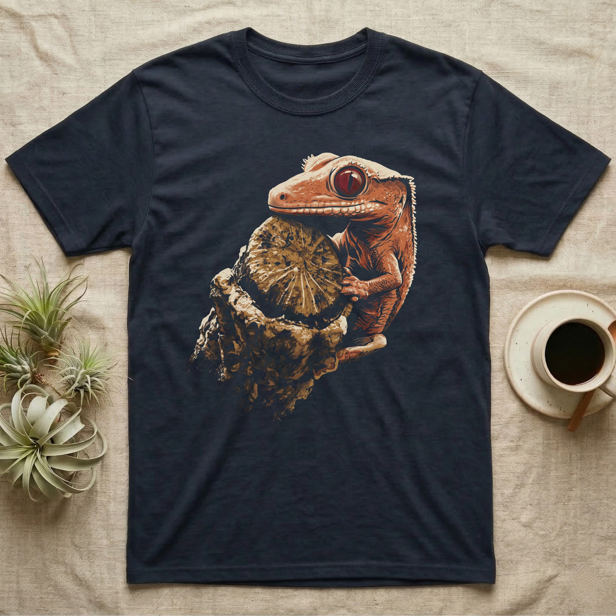 Illustration of a crested gecko gripping a weathered wooden stump in warm coral and terracotta tones, bold vintage-comic ink outlines, graphic-only, no text. — shown on a Navy tee.