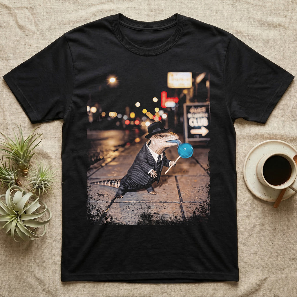 Blue Tongue Skink Detective T-Shirt in Black — Blue-tongued skink in a pinstripe suit and fedora holding a blue lollipop on a neon-lit rainy street.