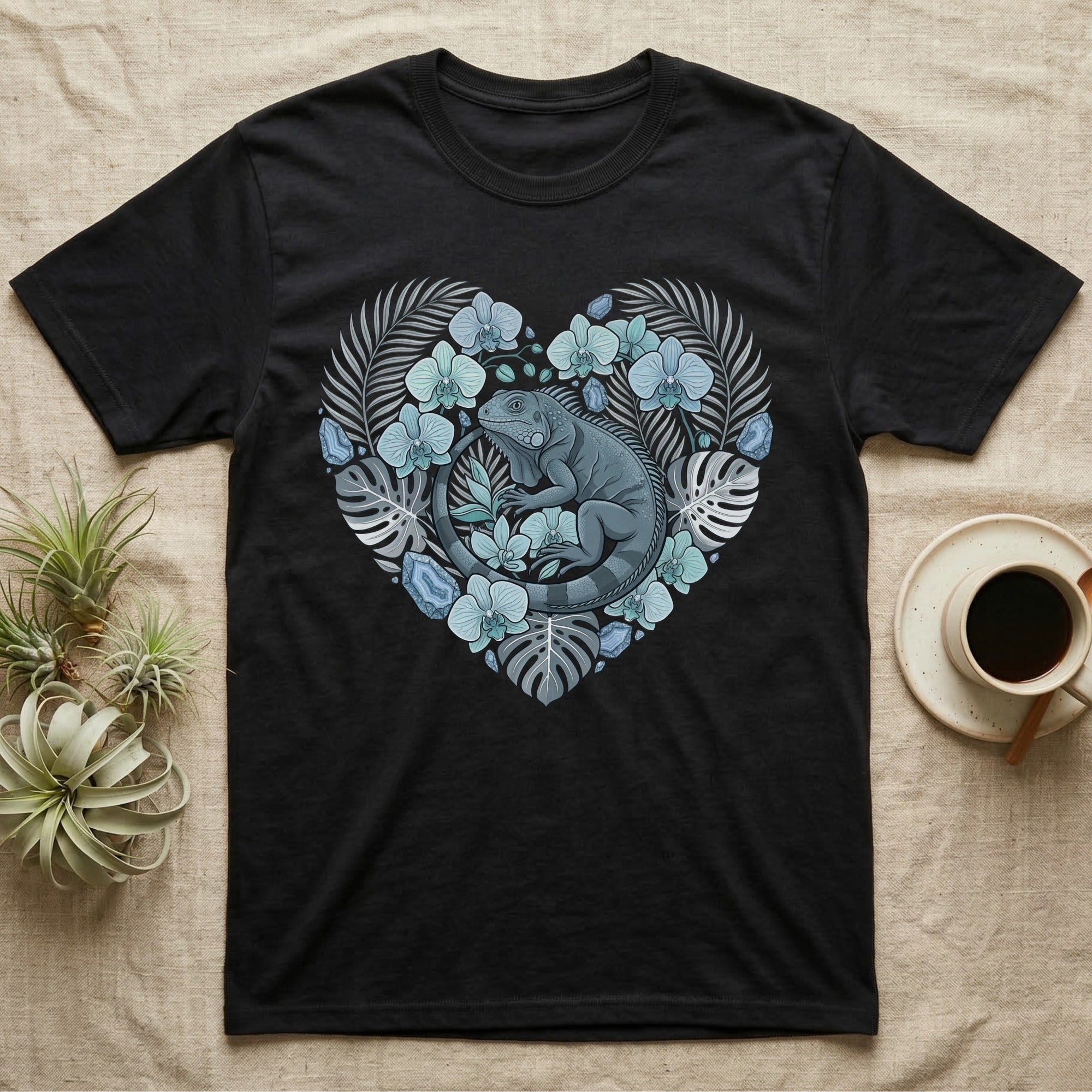 Black t-shirt with a heart-shaped iguana and floral design.
