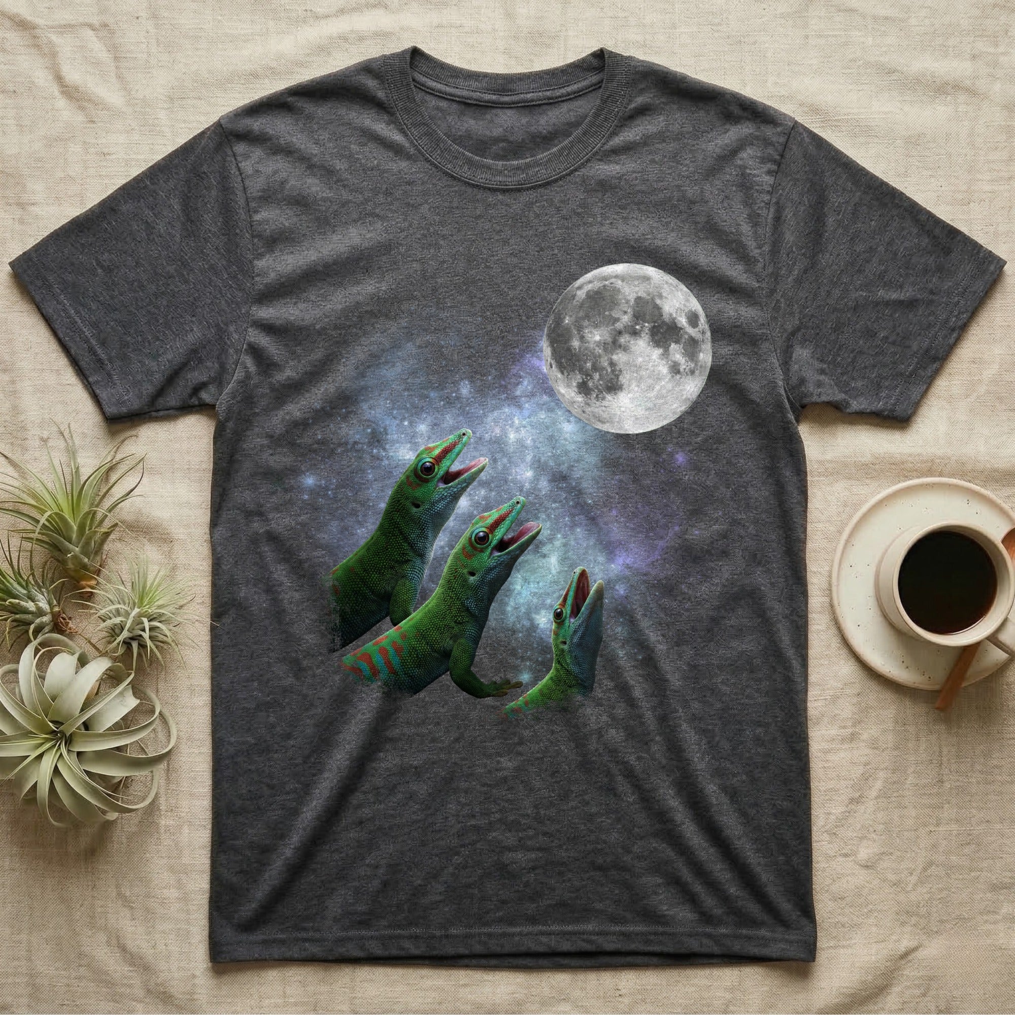 Giant Day Gecko Moon Howl T-Shirt in Dark Heather — Three Giant Day Gecko colour morphs howling at a full moon over a nebula on a dark grey t-shirt.