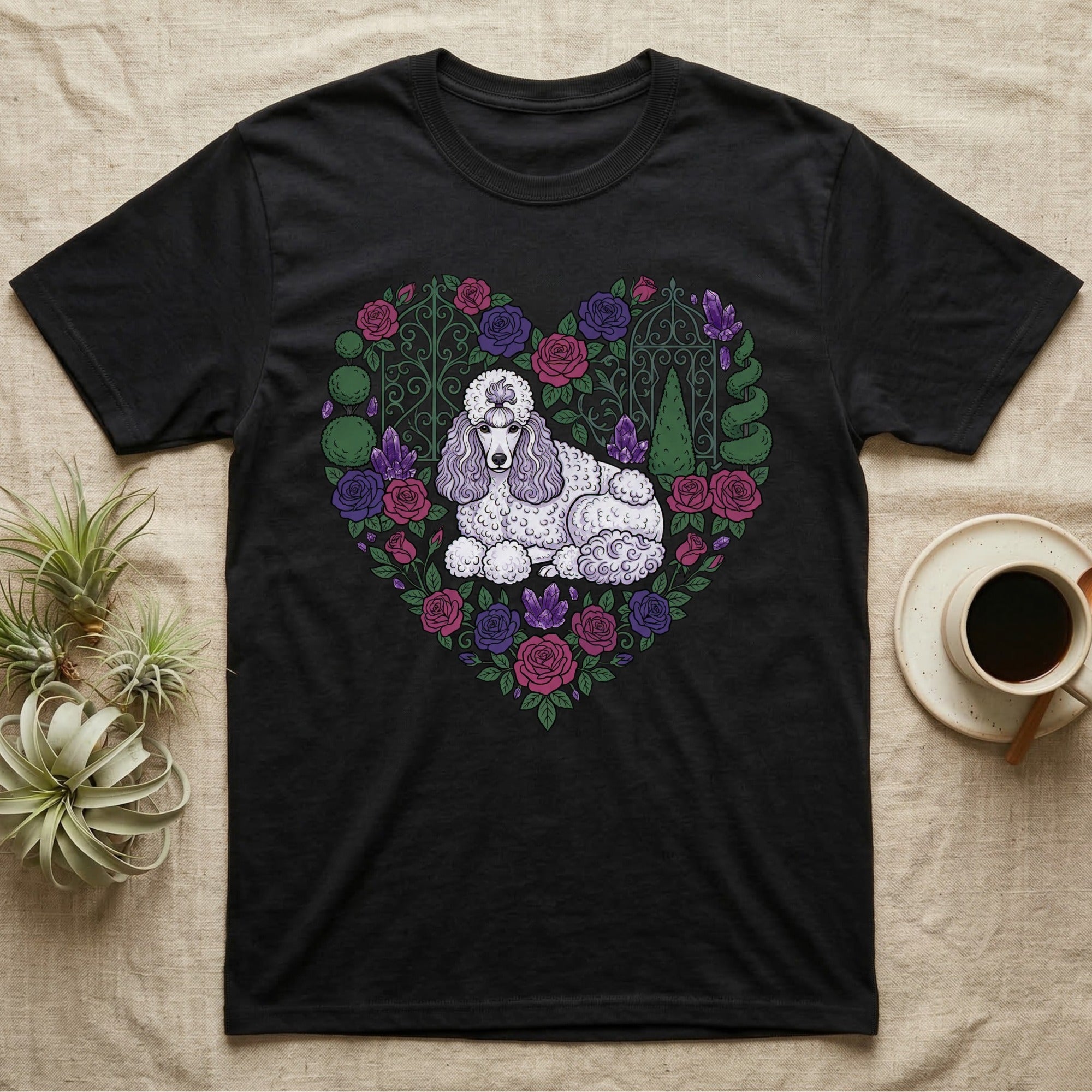 Black t-shirt with a white poodle in a heart-shaped floral arrangement.