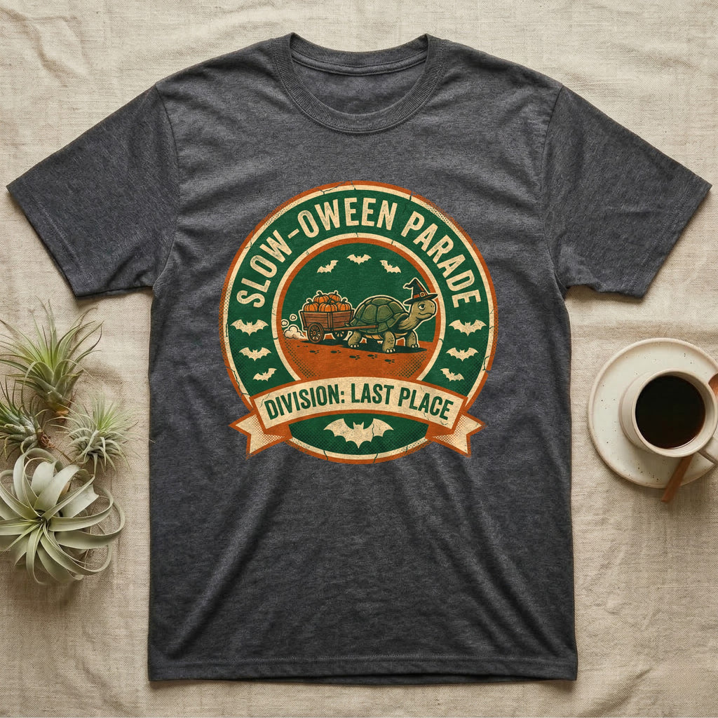 Tortoise Slow-oween Parade T-Shirt in Dark Heather — Distressed badge of a witch-hatted tortoise pulling a pumpkin wagon, "Slow-oween Parade, Division Last Place."