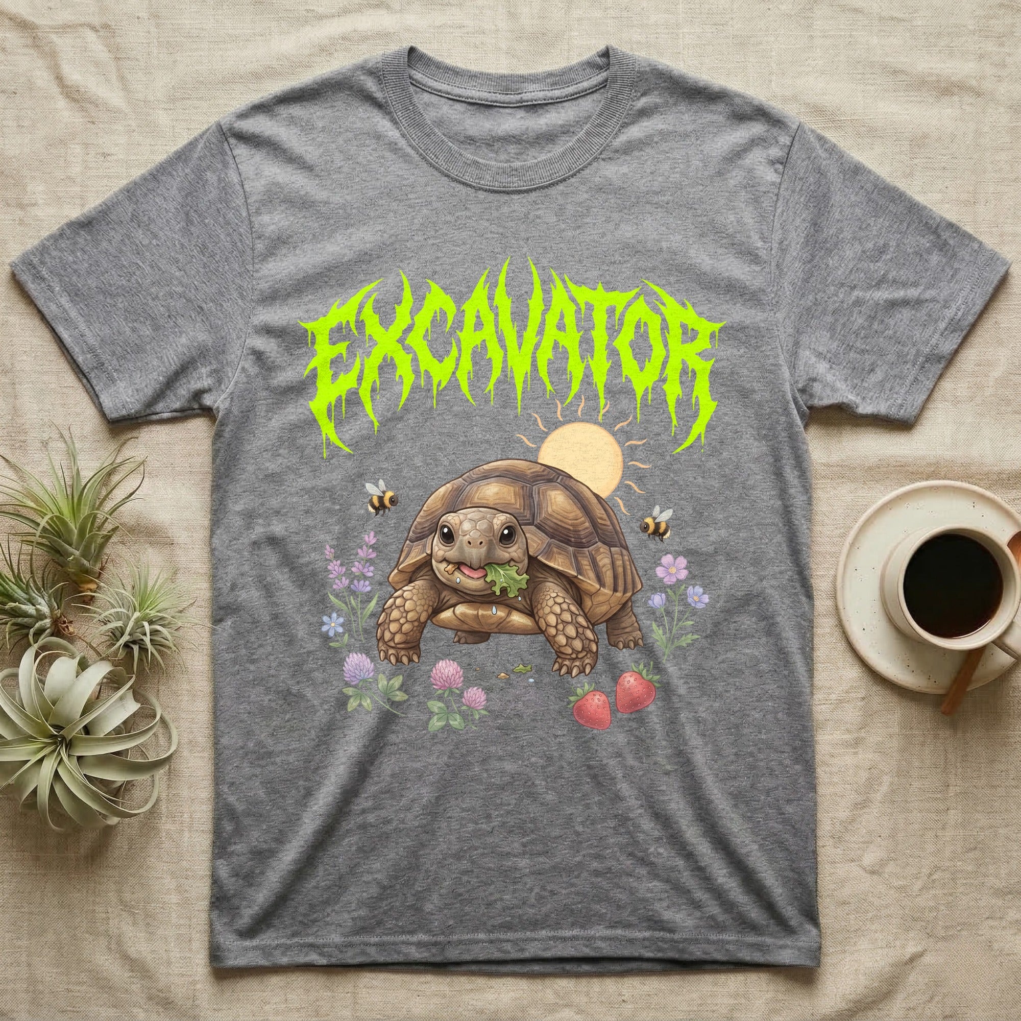 Russian Tortoise Feral T-Shirt in Sport Grey — Chubby Russian tortoise munching a green in a pastel meadow under a spiky lime metal wordmark reading EXCAVATOR.