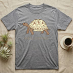 Grey t-shirt with a cartoon tortoise and "SHELL COUTURE" text.