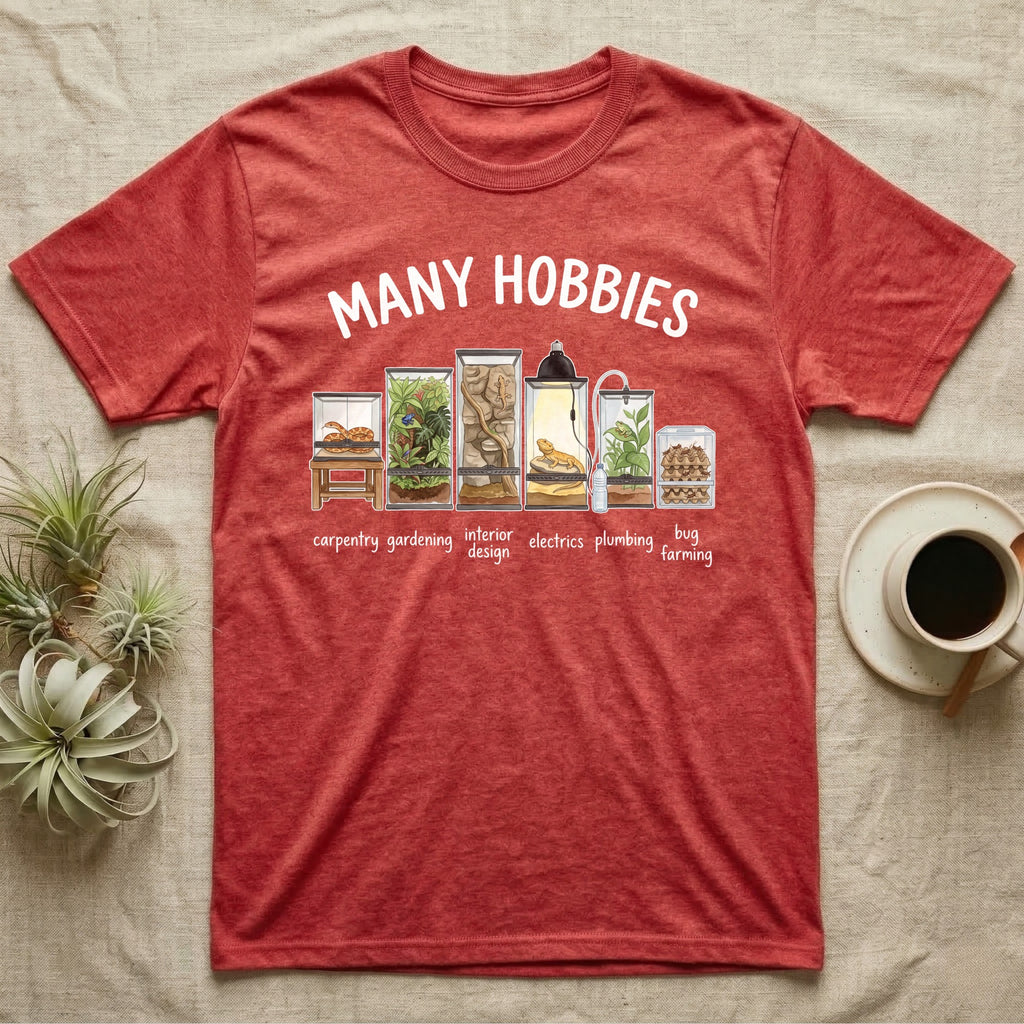 Reptile Terrarium Hobbies T-Shirt in Heather Red — Watercolour row of reptile vivariums with a snake, dart frog, gecko, bearded dragon, tree frog and a cricket bin under MANY HOBBIES, each labelled carpentry to bug farming