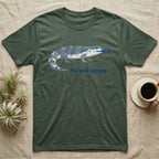 Green t-shirt with blue-tongued lizard graphic and "the blue-tongue." text.