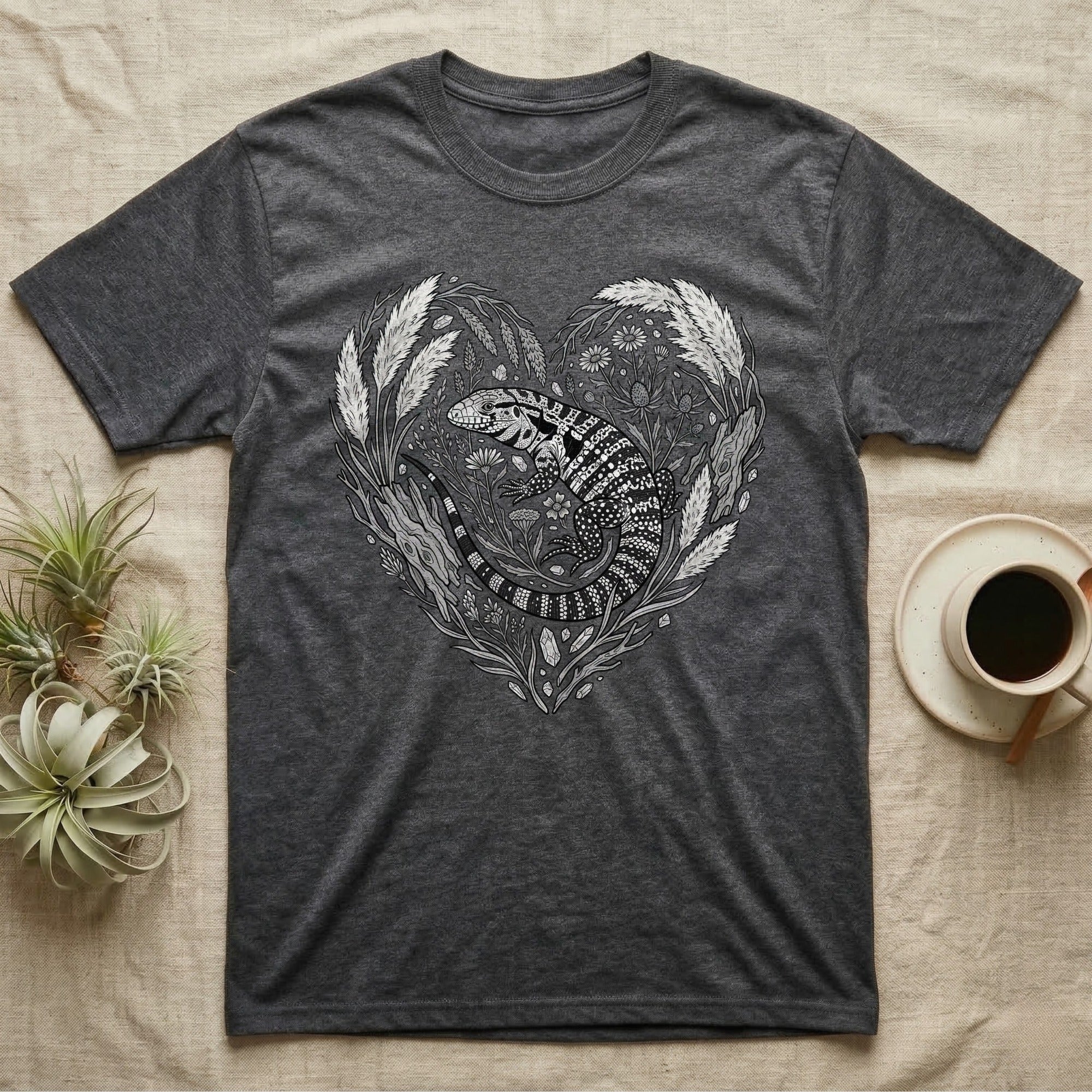 Dark grey t-shirt with a black and white heart-shaped animal and floral design.