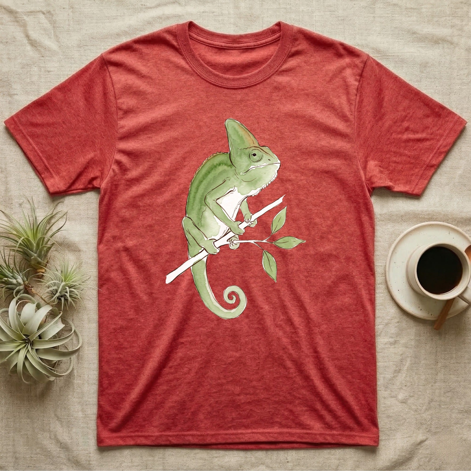 Veiled Chameleon Ambassador T-Shirt in Heather Red — Watercolour illustration of a veiled chameleon calmly gripping a slender branch, tall casque and curled tail.