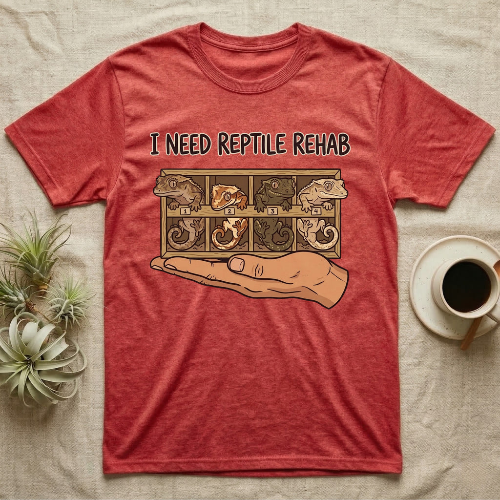 Crested Gecko Rehab T-Shirt in Heather Red — Vector scene of a hand presenting a rack of four crested geckos under a marker-style reptile rehab caption.