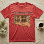 Crested Gecko Rehab T-Shirt in Heather Red — Vector scene of a hand presenting a rack of four crested geckos under a marker-style reptile rehab caption.