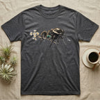 Jumping Spider Blossom T-Shirt in Dark Heather — Watercolor illustration of a black regal jumping spider with iridescent eyes holding a tiny wildflower sprig, on a dark grey t-shirt.