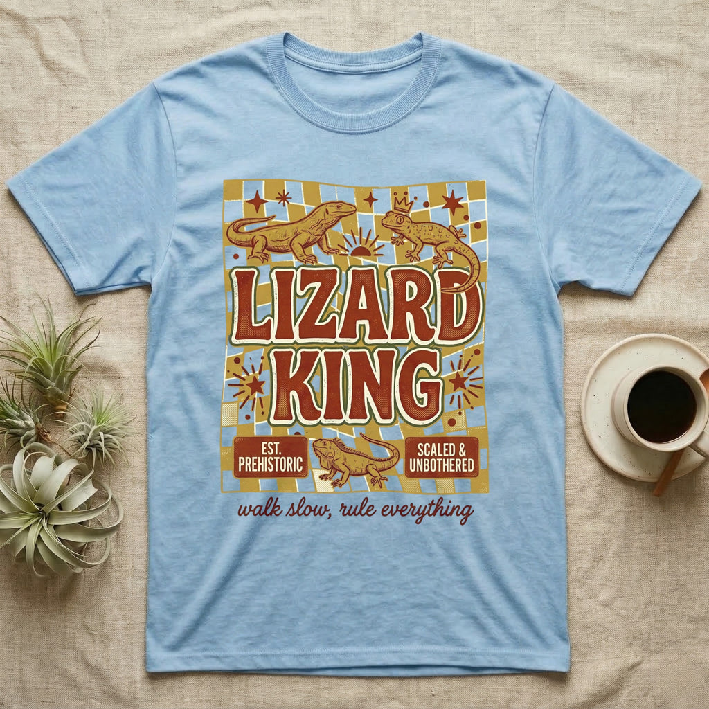 Light blue t-shirt with "Lizard King" graphic featuring two lizards and the phrase "walk slow, rule everything".