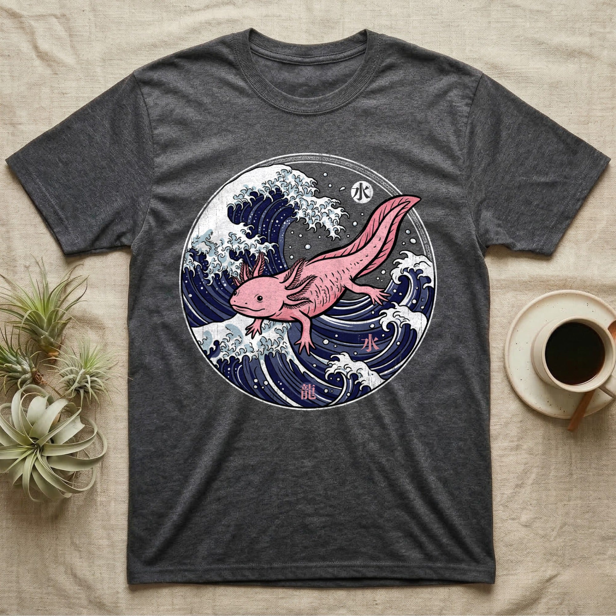 Dark gray t-shirt with pink axolotl in a Japanese wave design.