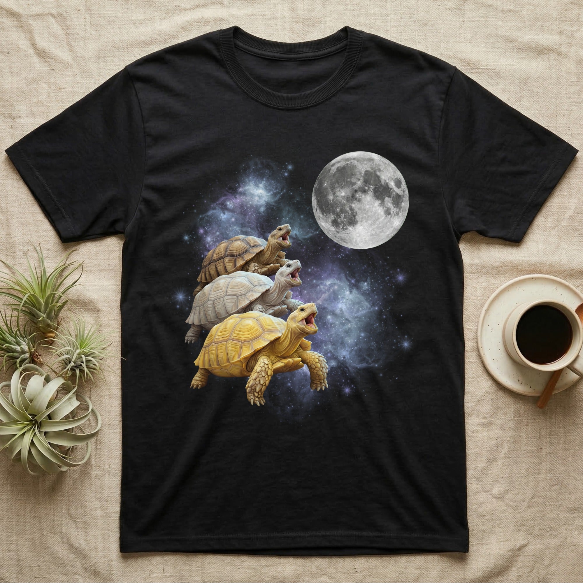 Sulcata Tortoise Moon Howl T-Shirt in Black — Three Sulcata Tortoise colour morphs howling at a full moon over a nebula on a dark grey t-shirt.