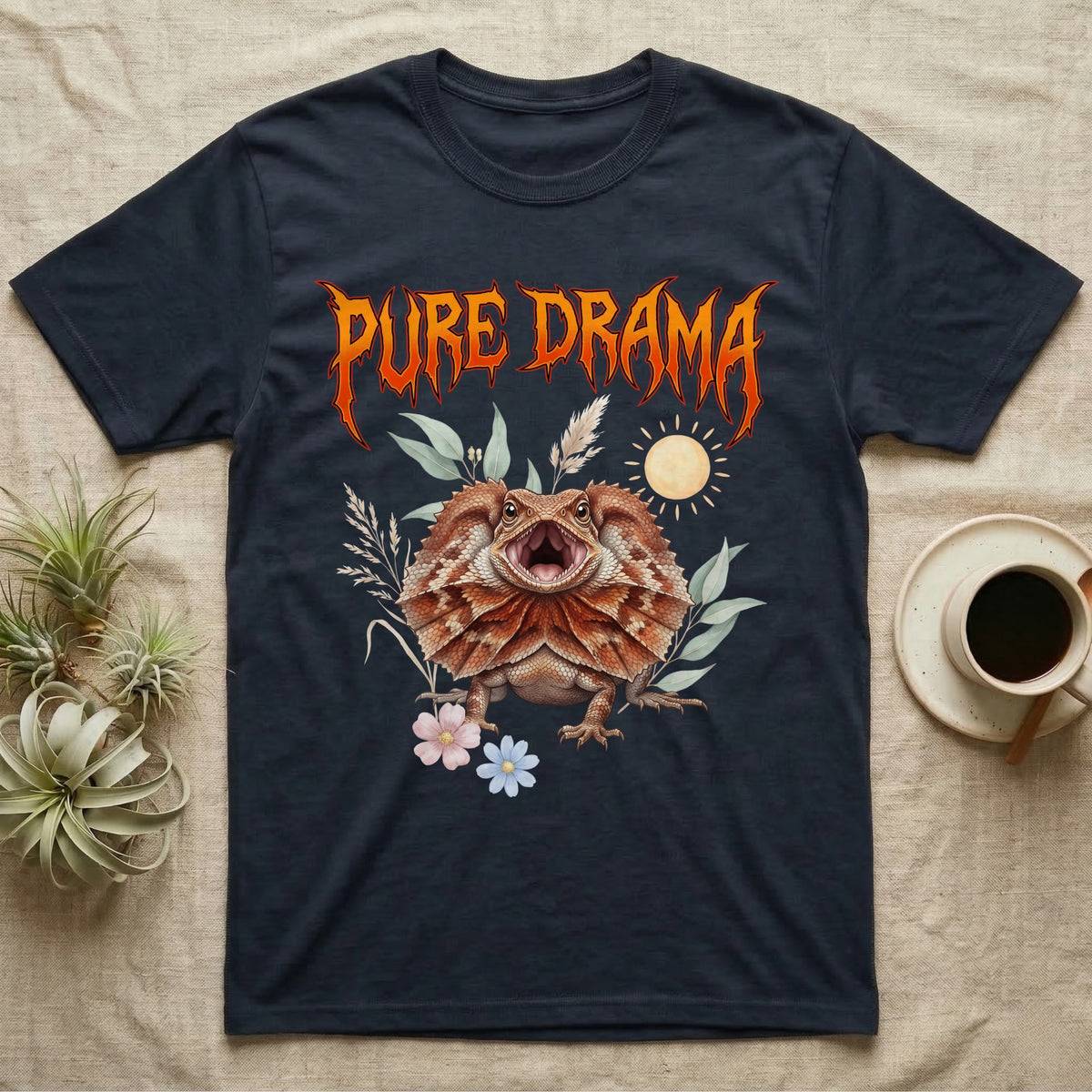 Frilled Dragon Feral T-Shirt in Navy — Frilled dragon with its neck frill flared and mouth gaping under a jagged fiery-orange metal "PURE DRAMA" wordmark.