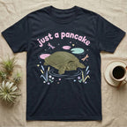 Spiny Softshell Turtle Baby T-Shirt in Navy — Pastel spiny softshell turtle with flat shell and snorkel nose among lily pads, puffy pink wordmark "just a pancake" above.