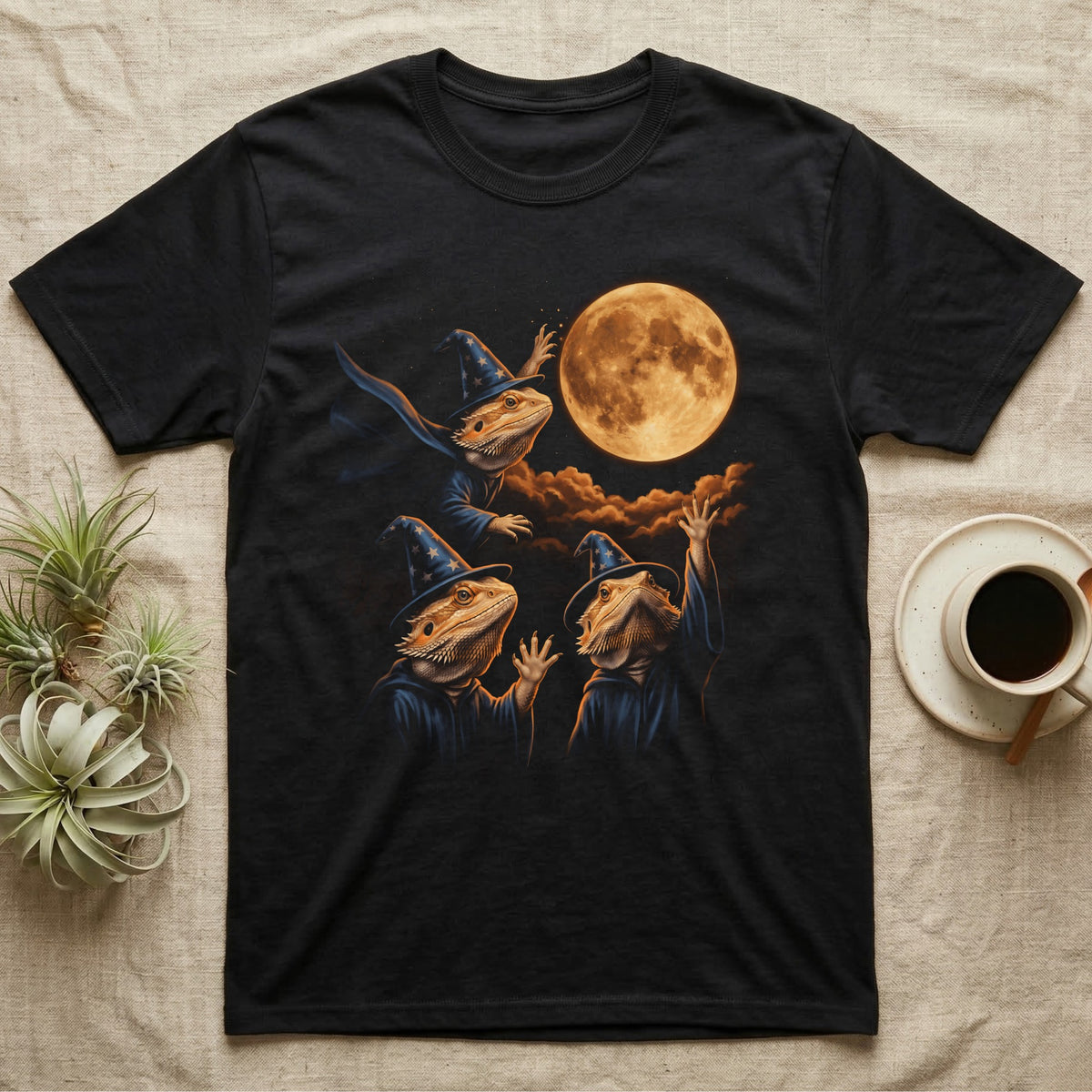 Bearded Dragon Wizard T-Shirt in Black — Three bearded dragons in blue wizard hats and robes under a glowing amber full moon, one casting sparks, two waving up