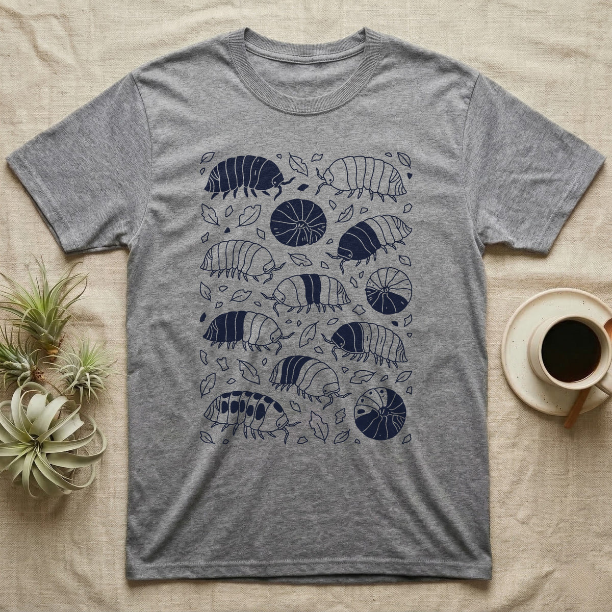 Cubaris Isopod Morph Collection T-Shirt in Sport Grey — Deep navy single-ink illustration of Cubaris isopods in varied morph patterns scattered across leaf litter.