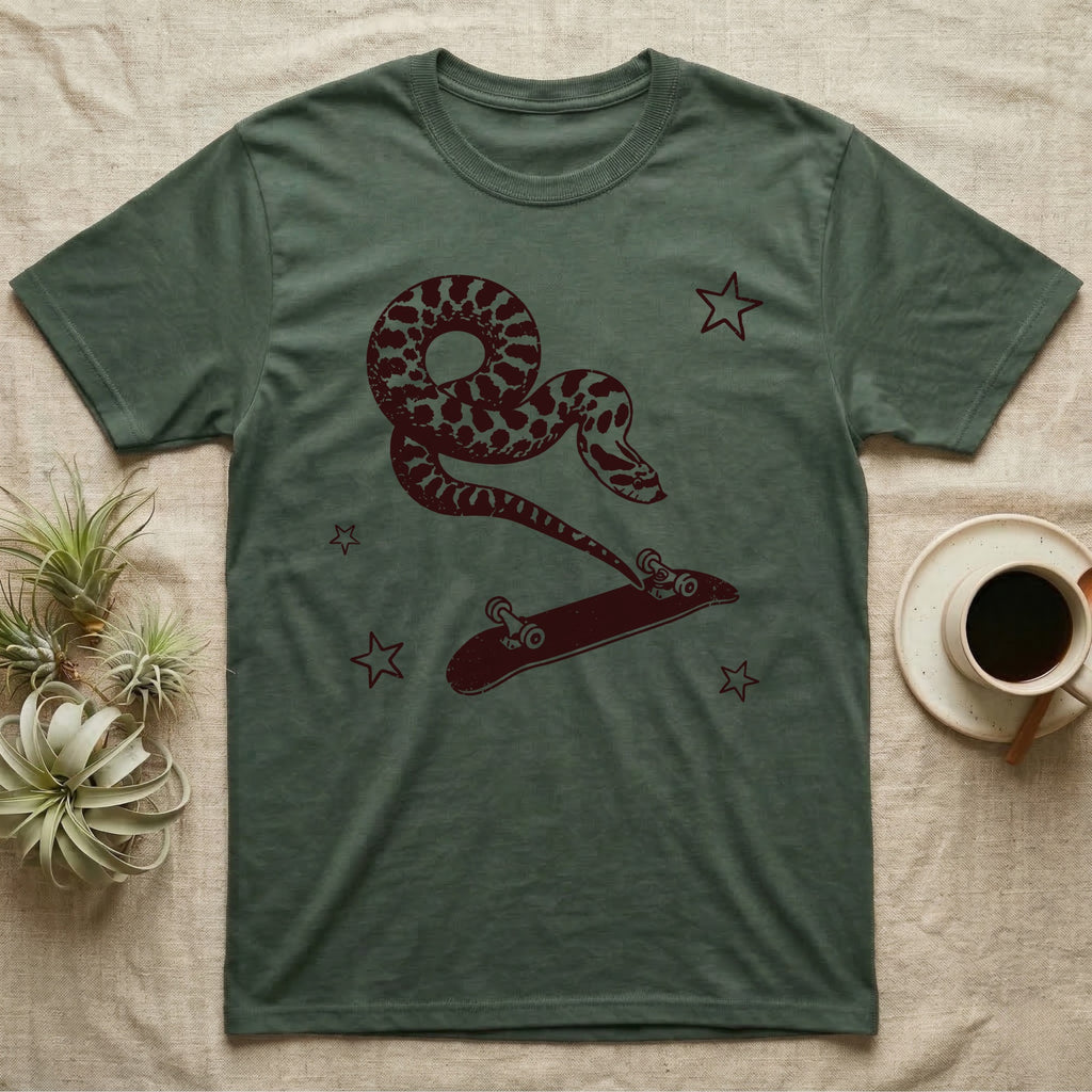 Western Hognose Kickflip T-Shirt in Military Green — Distressed one-ink oxblood screenprint of a western hognose snake airborne, tail snapped straight into a skateboard caught upside down mid-kickflip.