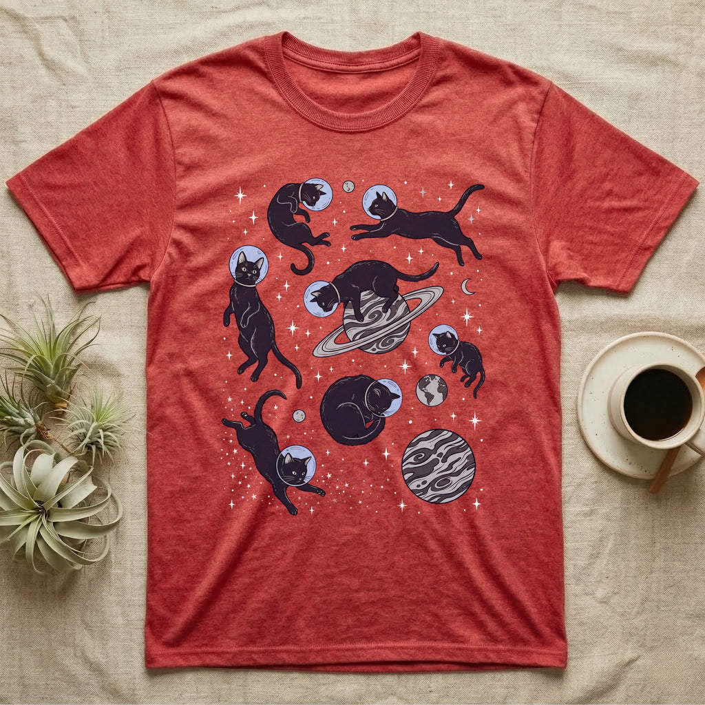 Red t-shirt with black cats in space graphic, including planets and stars.