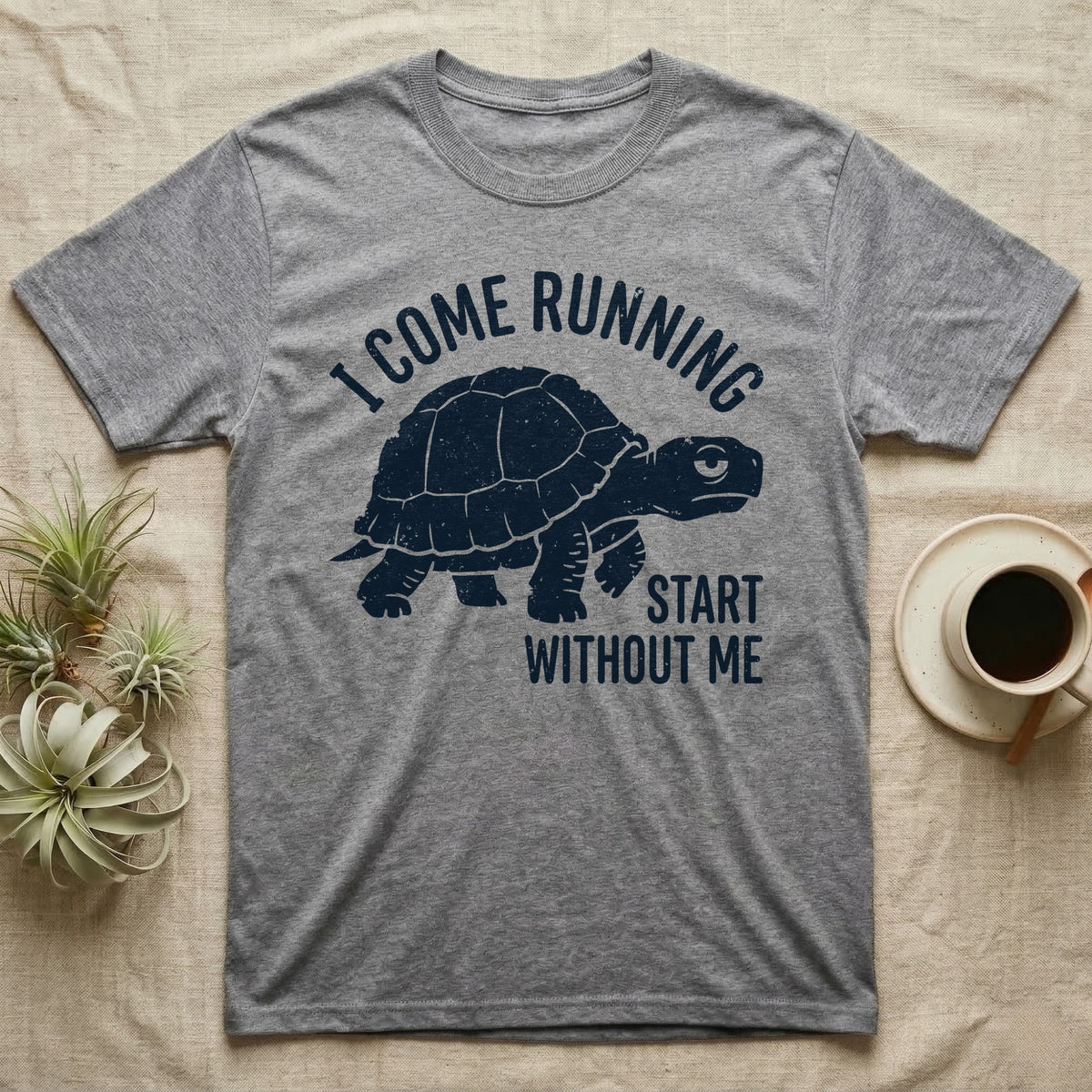 Red-Foot Tortoise Running T-Shirt in Sport Grey — Navy silhouette of a red-footed tortoise walking under arched words I Come Running, beside Start Without Me