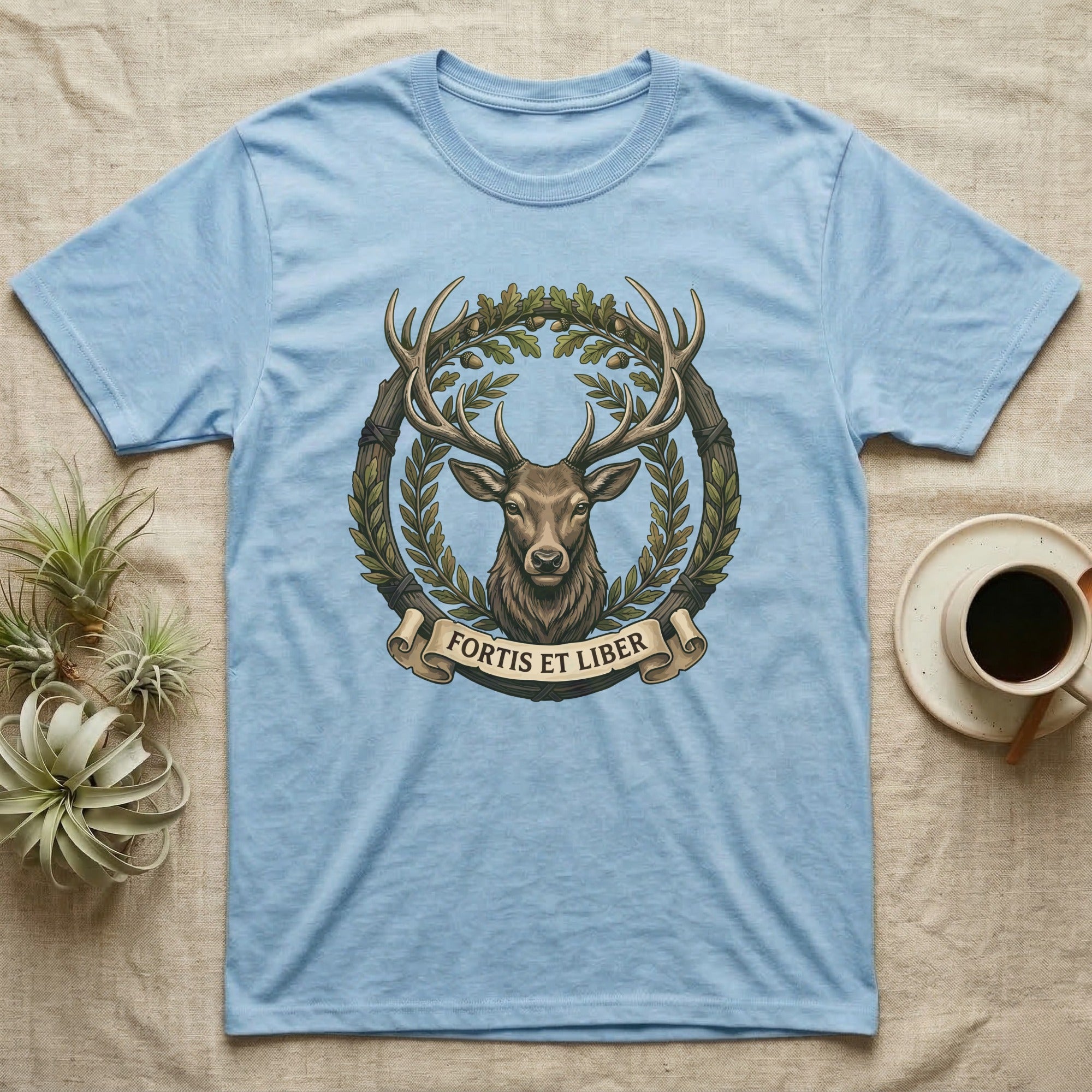 Light blue t-shirt with deer and laurel wreath design.