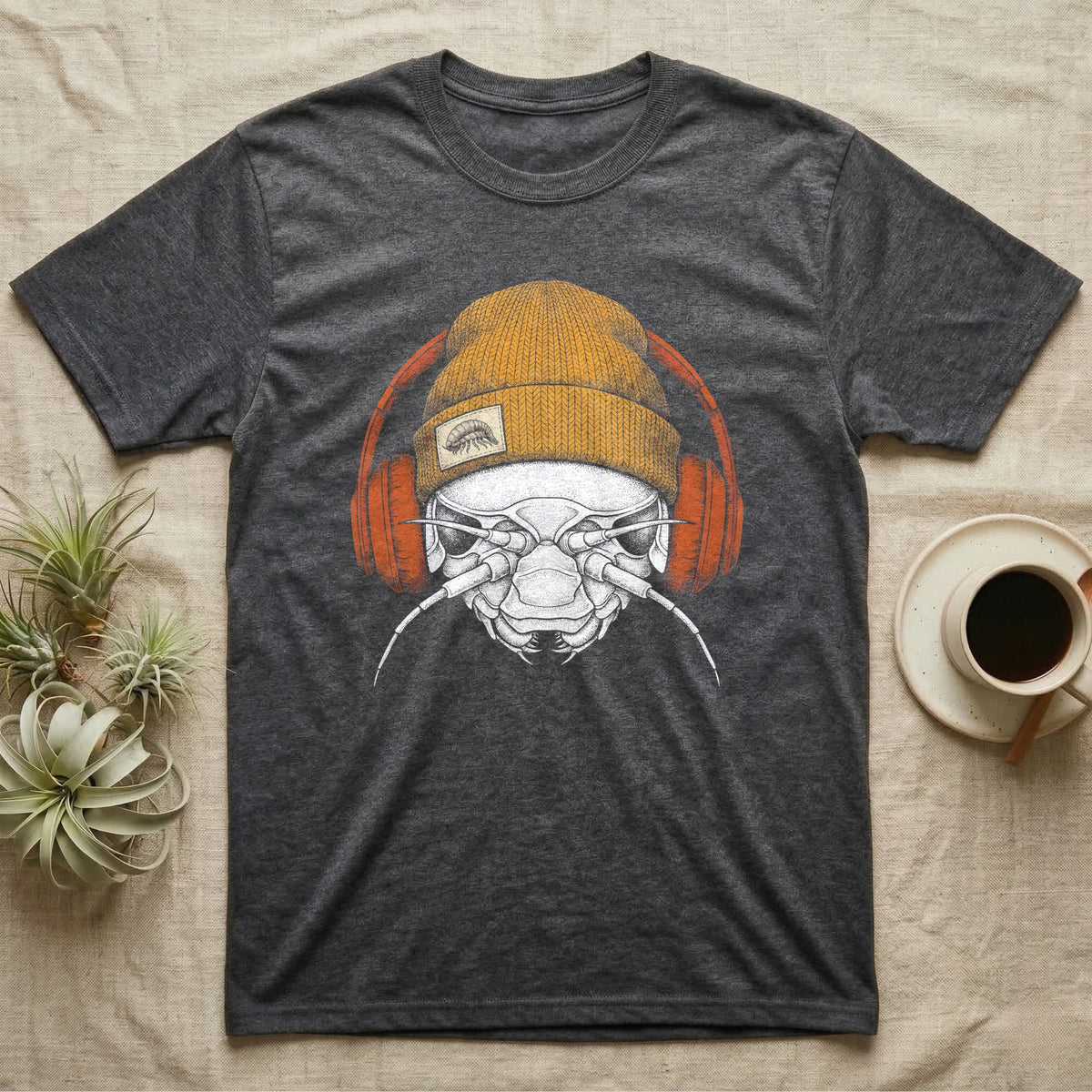 Isopod Heavy Beats T-Shirt in Dark Heather — Engraved isopod with detailed chitin plating and antennae, wearing a knit beanie and over-ear headphones.