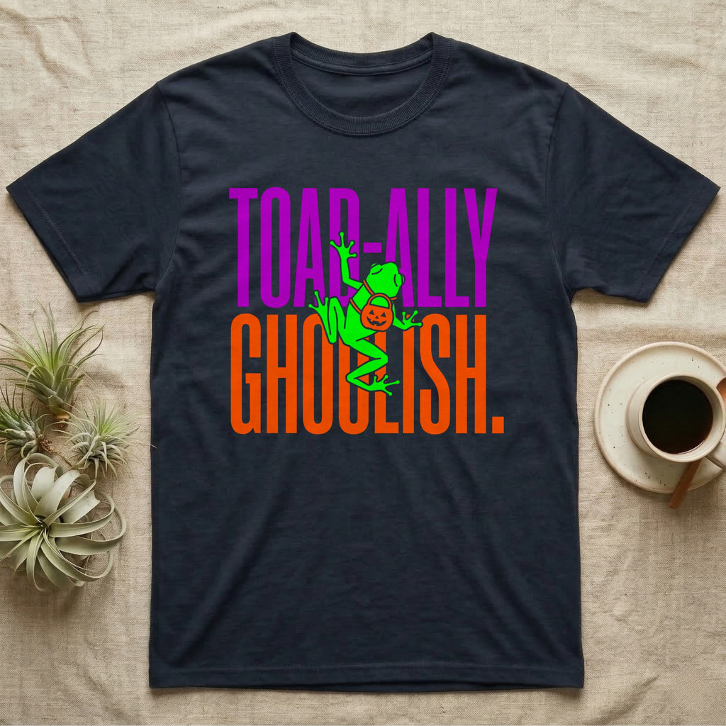 Tree Frog Toad-ally Ghoulish T-Shirt in Navy — Neon green tree frog with a pumpkin pail clinging across stacked text, "Toad-ally Ghoulish."