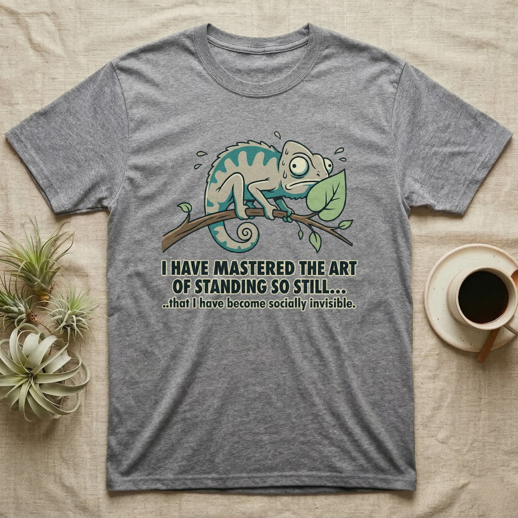T-shirt with cartoon chameleon on a branch, text "I HAVE MASTERED THE ART OF STANDING SO STILL... ..that I have become socially invisible."