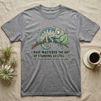 T-shirt with cartoon chameleon on a branch, text "I HAVE MASTERED THE ART OF STANDING SO STILL... ..that I have become socially invisible."