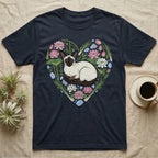 Dark t-shirt with a Siamese cat surrounded by lotus flowers forming a heart.