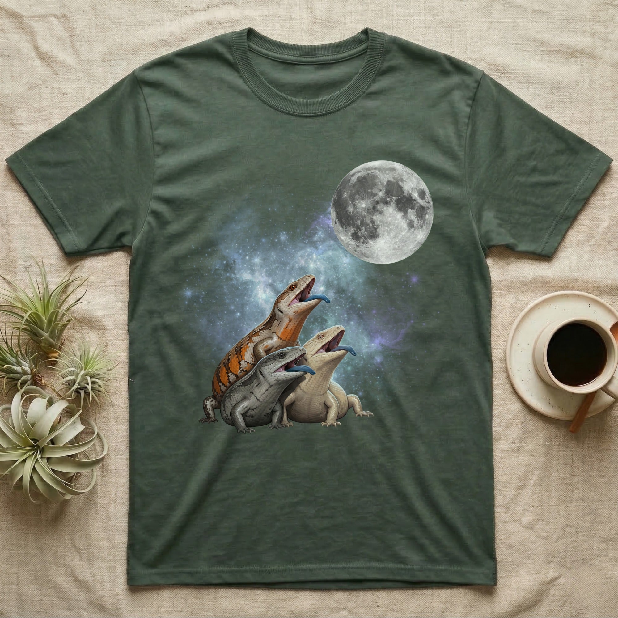 Blue-Tongued Skink Moon Howl T-Shirt in Military Green — Three Blue-Tongued Skink colour morphs howling at a full moon over a nebula on a dark grey t-shirt.