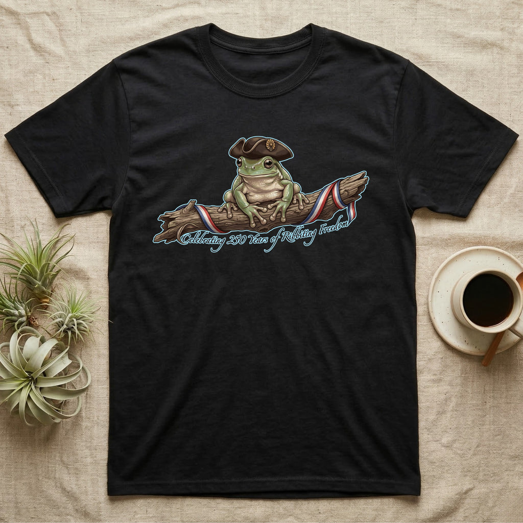 Tree Frog Freedom T-Shirt in Black — Detailed green tree frog in a tricorn hat on a ribboned branch under script Celebrating 250 Years of Freedom.