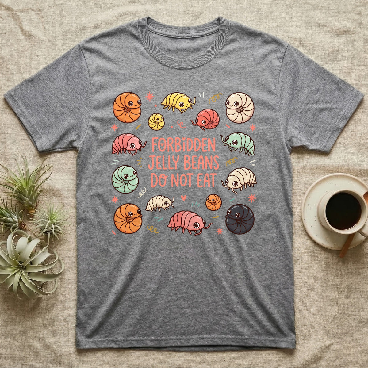 Gray t-shirt with cartoon rolly pollies and text "FORBIDDEN JELLY BEANS DO NOT EAT".