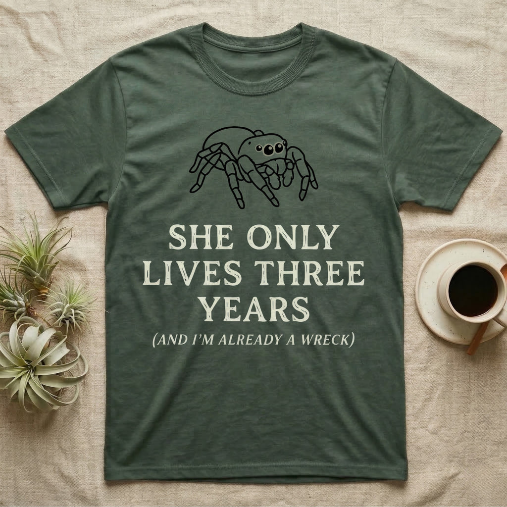 Jumping Spider Three Years Tee in Military Green — Vintage-ink Phidippus jumping spider portrait above type "She Only Lives Three Years (And I'm Already A Wreck)."