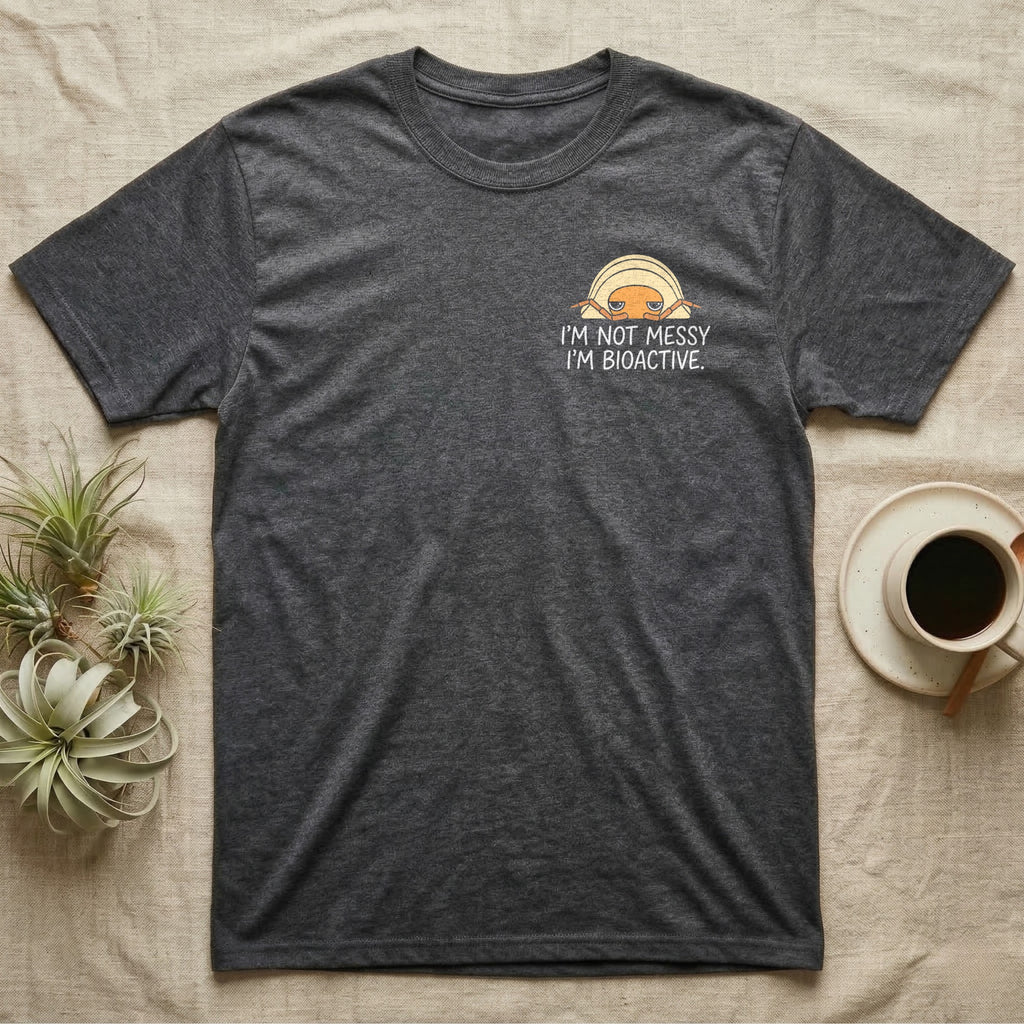 Bioactive Rubber Ducky T-Shirt in Dark Heather — Creamy-yellow rubber ducky isopod with an orange face peeking over white marker capitals reading I'M NOT MESSY I'M BIOACTIVE.