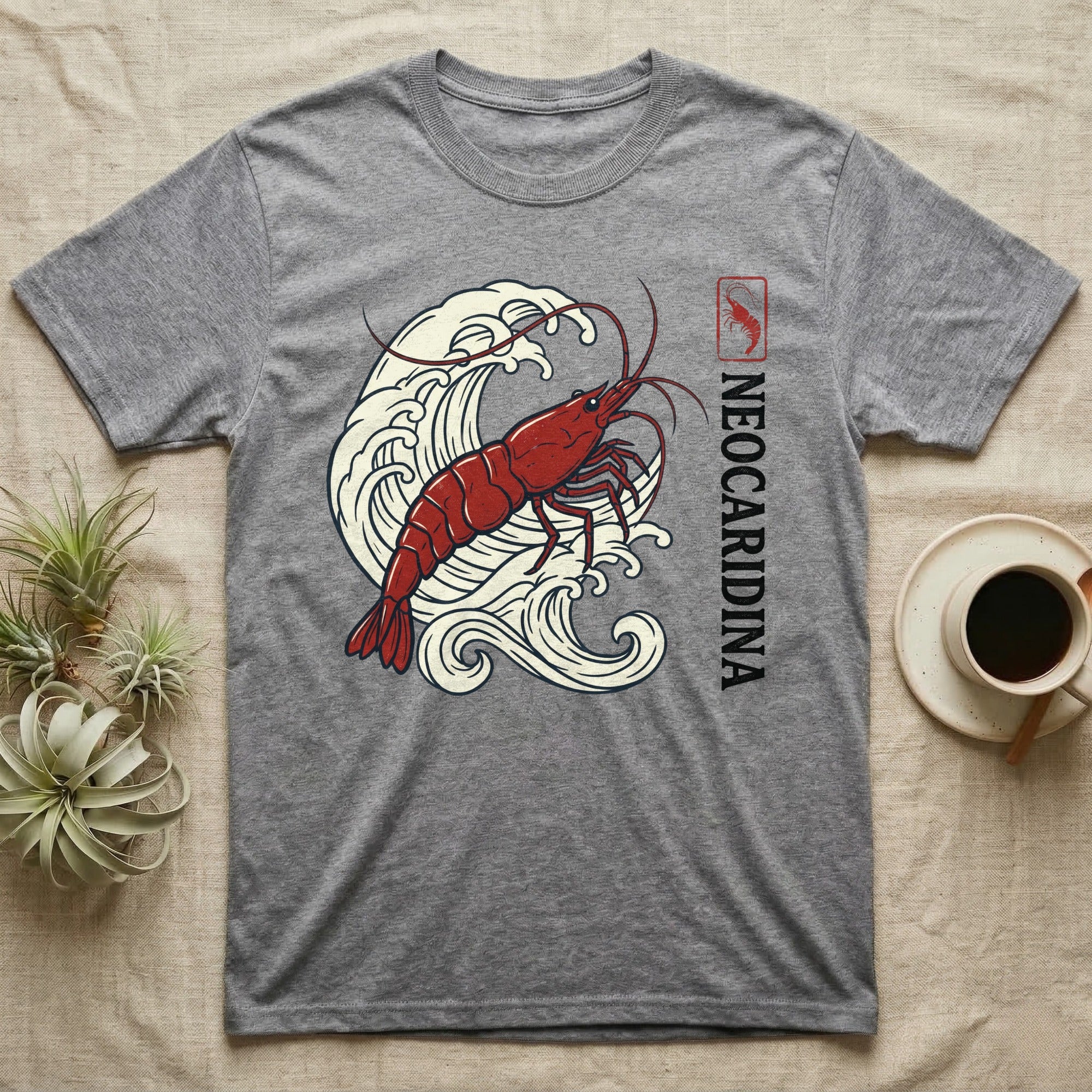 Grey t-shirt with a red shrimp and Japanese wave design.