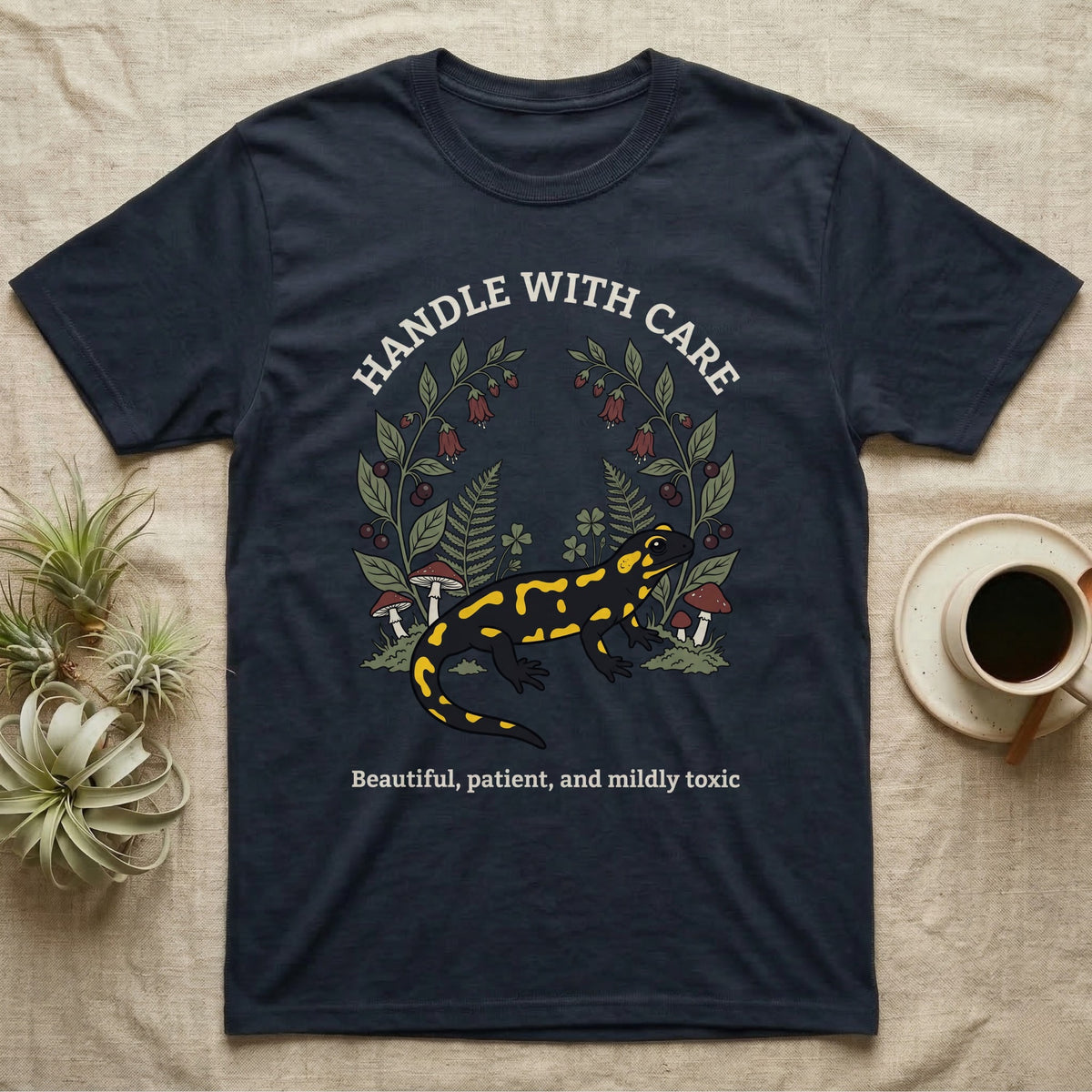 Fire Salamander Poison Plate T-Shirt in Navy — Naturalist apothecary-plate illustration of a fire salamander framed by a symmetric wreath of woodland botanicals.