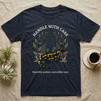 Fire Salamander Poison Plate T-Shirt in Navy — Naturalist apothecary-plate illustration of a fire salamander framed by a symmetric wreath of woodland botanicals.