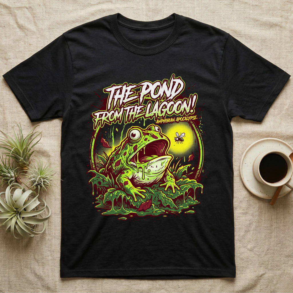 Pacman Frog Lagoon Apocalypse T-Shirt in Black — B-movie horror poster of a Pacman frog bursting from slime at a fly, "The Pond From the Lagoon, Amphibian Apocalypse."