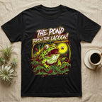 Pacman Frog Lagoon Apocalypse T-Shirt in Black — B-movie horror poster of a Pacman frog bursting from slime at a fly, "The Pond From the Lagoon, Amphibian Apocalypse."
