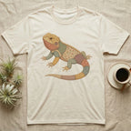 Beige t-shirt with a patchwork lizard graphic.