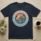 Navy t-shirt with circular vintage surf club graphic featuring a van and crabs.